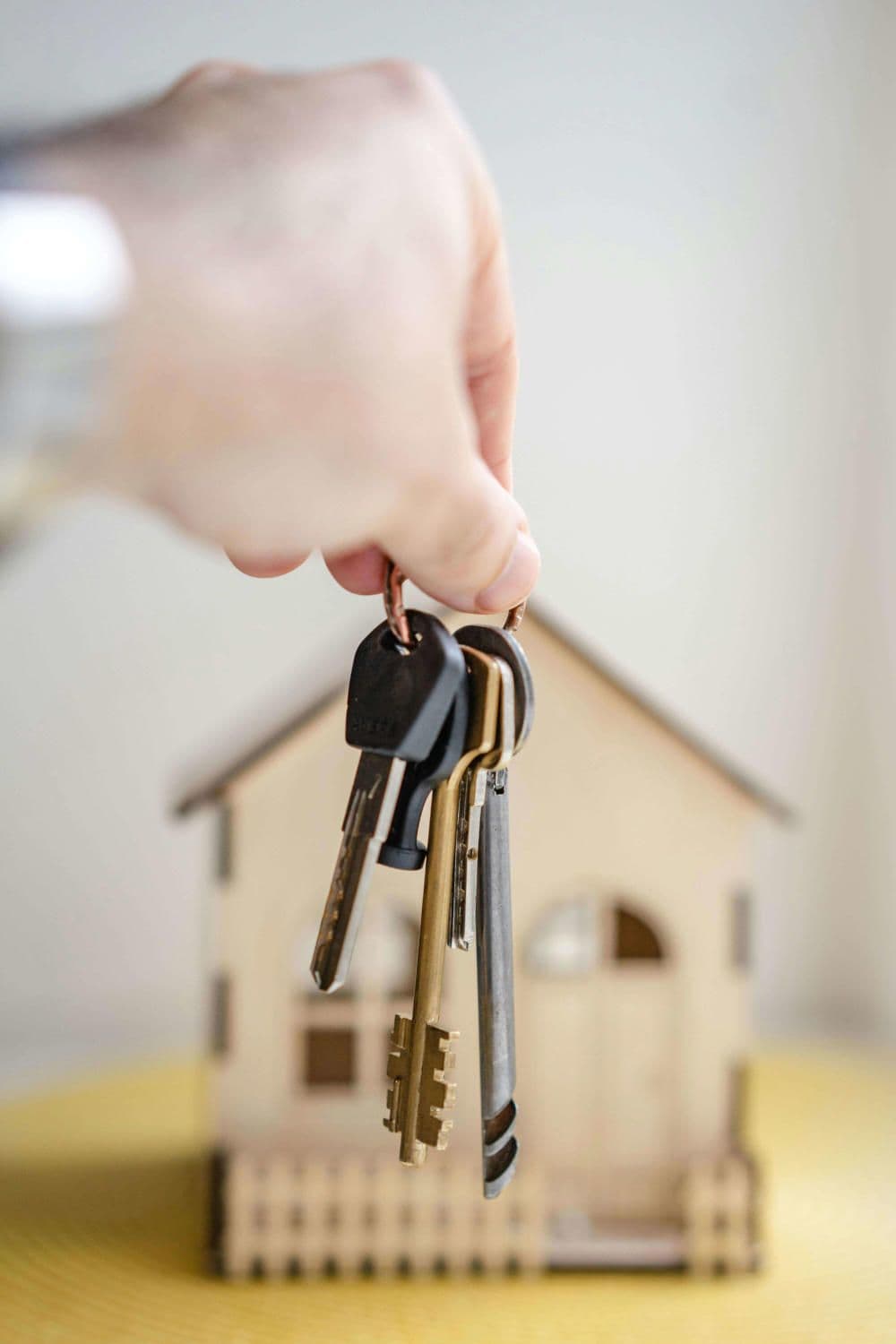 Friendly couple smiling while shaking hands with a mortgage broker